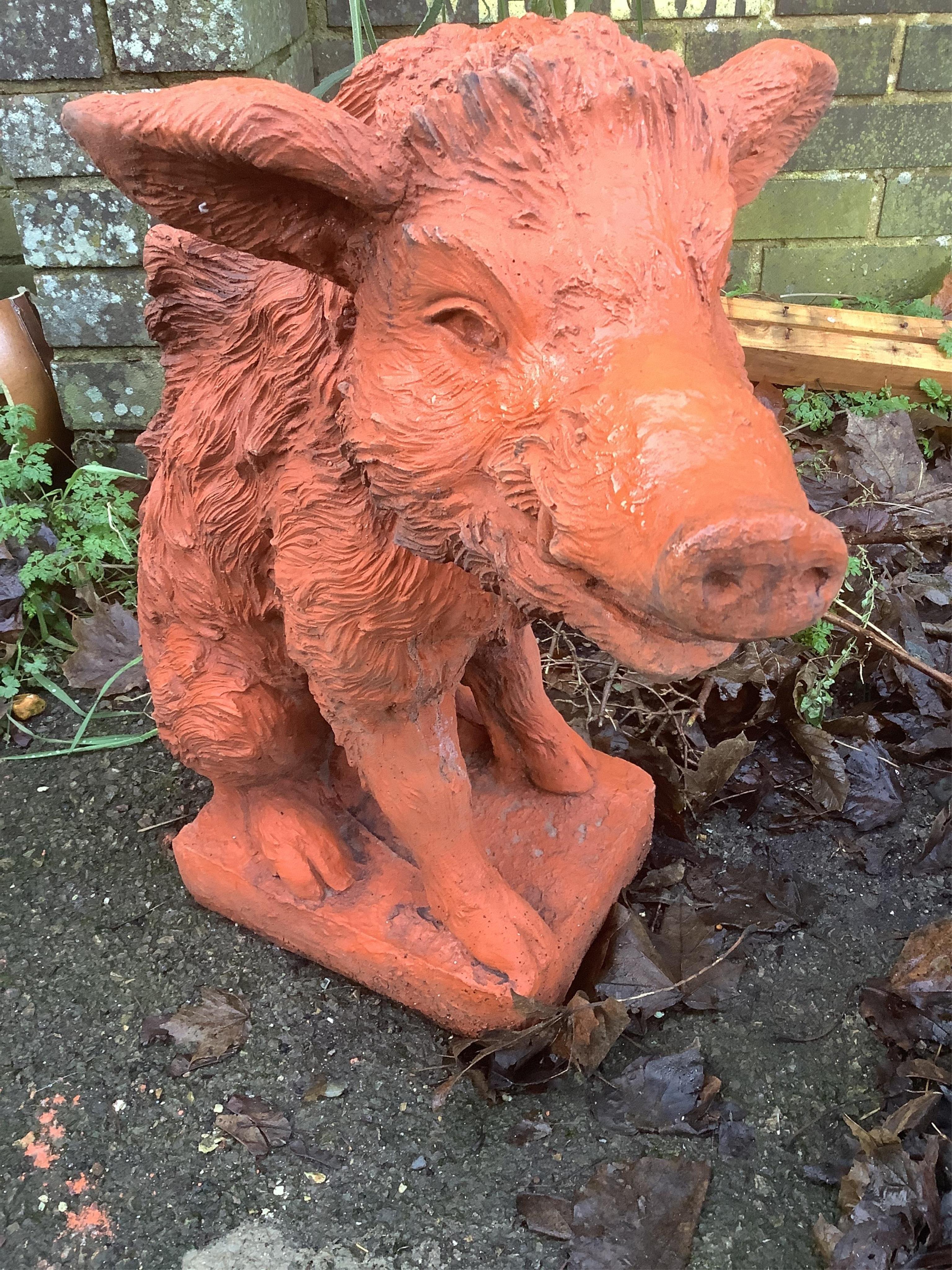 A pair of terracotta boars. Condition